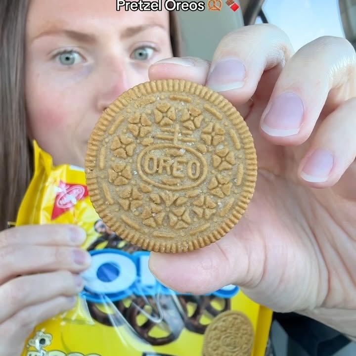 Instagram post by @morganchomps for Oreo. Caption reads: TRYING NEW CHOCOLATE COVERED PRETZEL OREOS 🥨🍫....