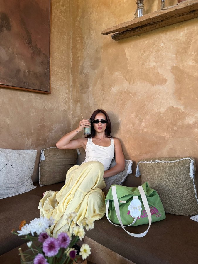 Instagram post by @kat.kristian for NEWME. Caption reads: Travel version of me is wild… I can do 10 things,....