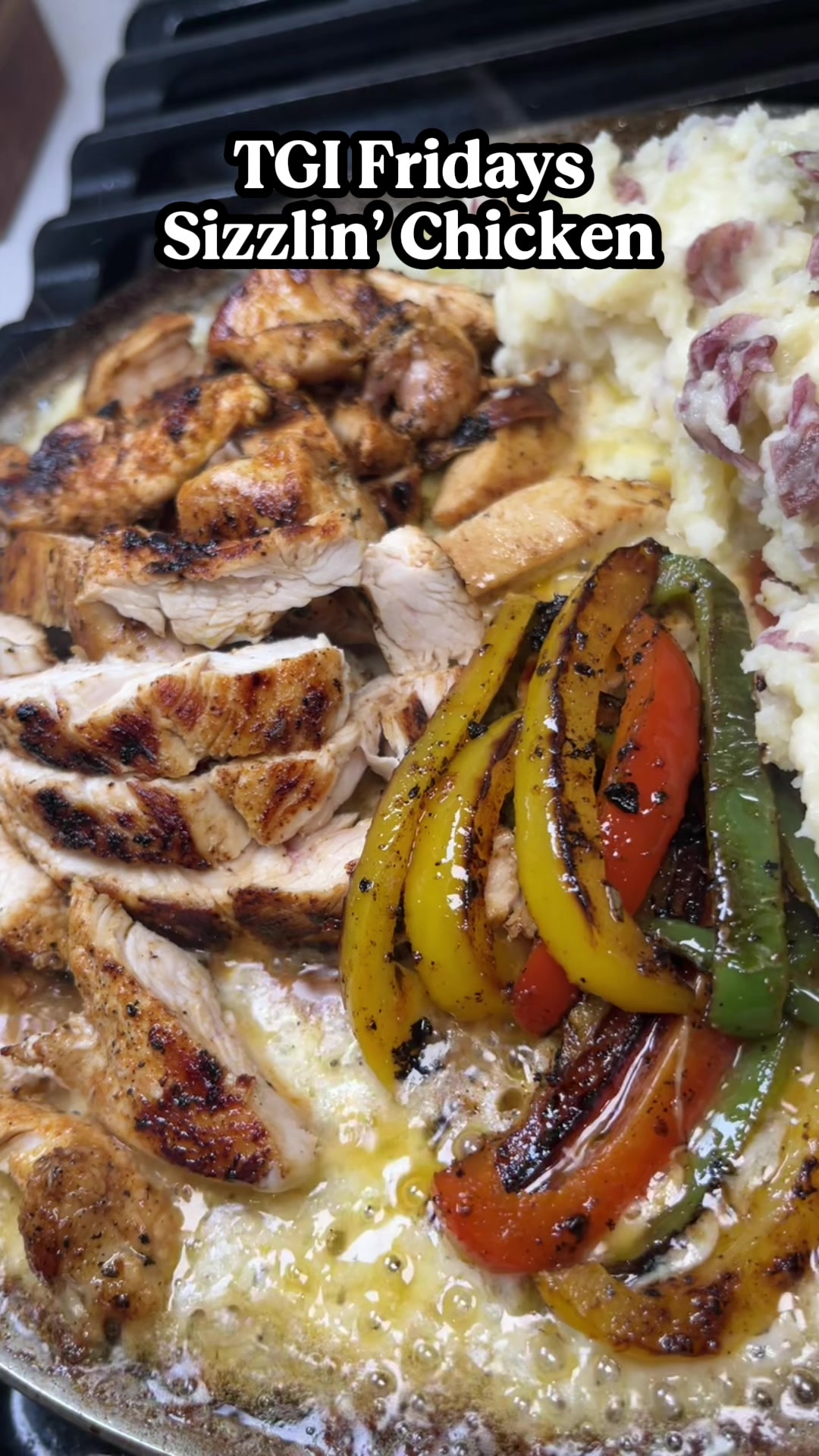 TikTok post by @callmecandace.tv for TGI Fridays. Caption reads: TGI Fridays Sizzlin Chicken 🔥 one of my favorite....