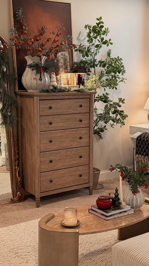 Instagram post by @decorcrushdaily for Afloral. Caption reads: The dried-look pomegranate stem from @afloral adds....