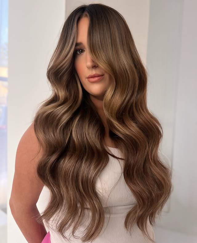 Instagram post by @khamilton.hair for Donna Bella Hair. Caption reads: [...] rows and 4 custom-blended shades of....