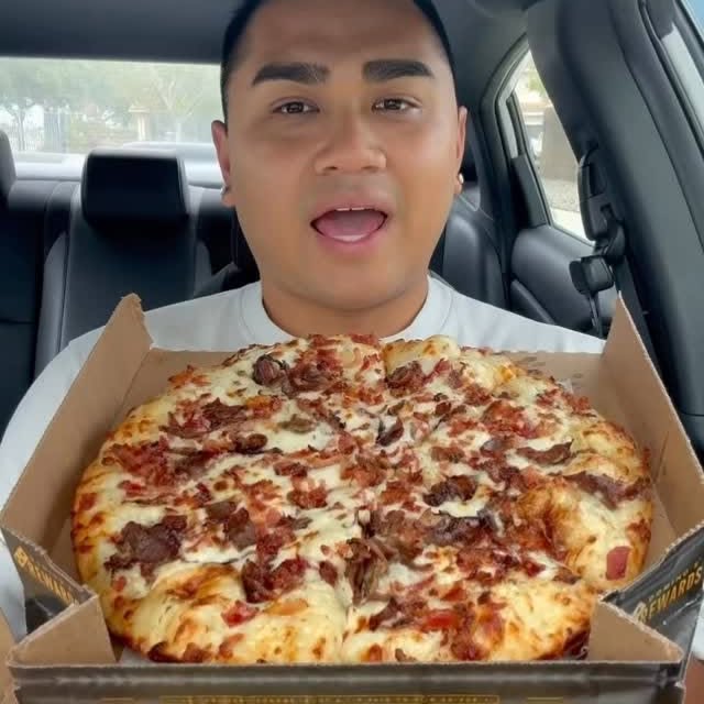 Instagram post by @natelo98 for Domino's. Caption reads: #ad I partnered with Domino’s to try YOUR favorite....