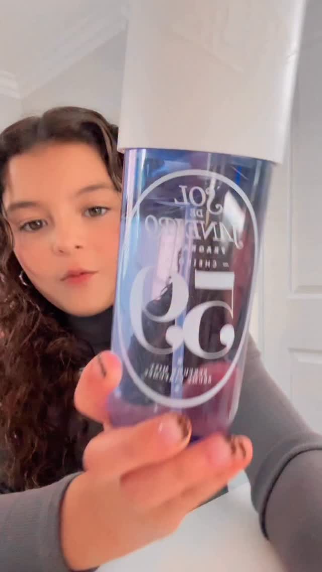 Instagram post by @curly_ollie for Sol de Janeiro. Caption reads: you already know what I use on the daily....