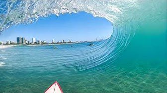 YouTube post by @SurfingWithNoz for Partnerize. Caption reads: SURFING PERFECT BURLEIGH BARRELS! (RAW POV).