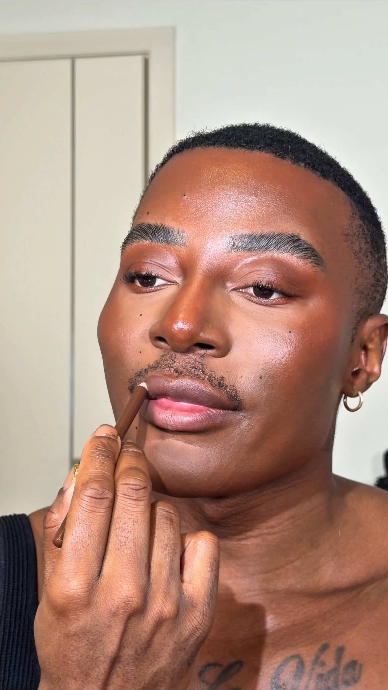 TikTok post by @garythompson for e.l.f. Cosmetics. Caption reads: e.l.f. X Fashion & Beauty Award nominee....