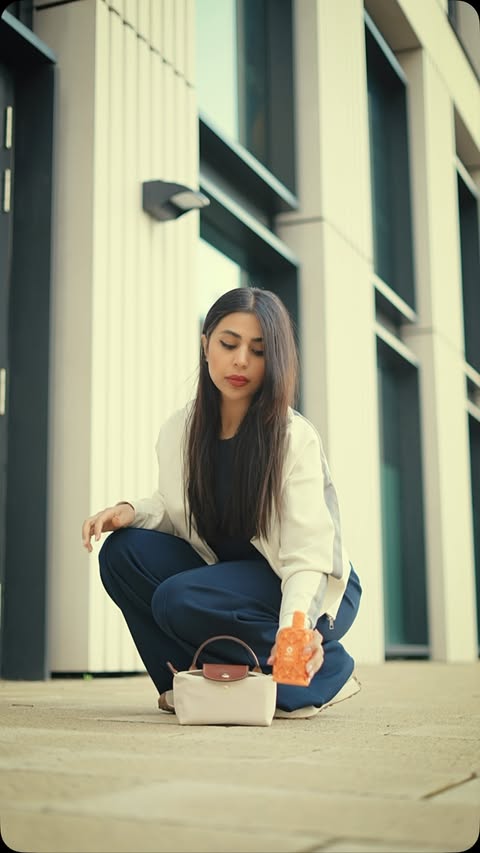 Instagram post by @noursa.dimon for LONGCHAMP. Caption reads: [...] call😊 Perfume @orienticaperfumes Bag....