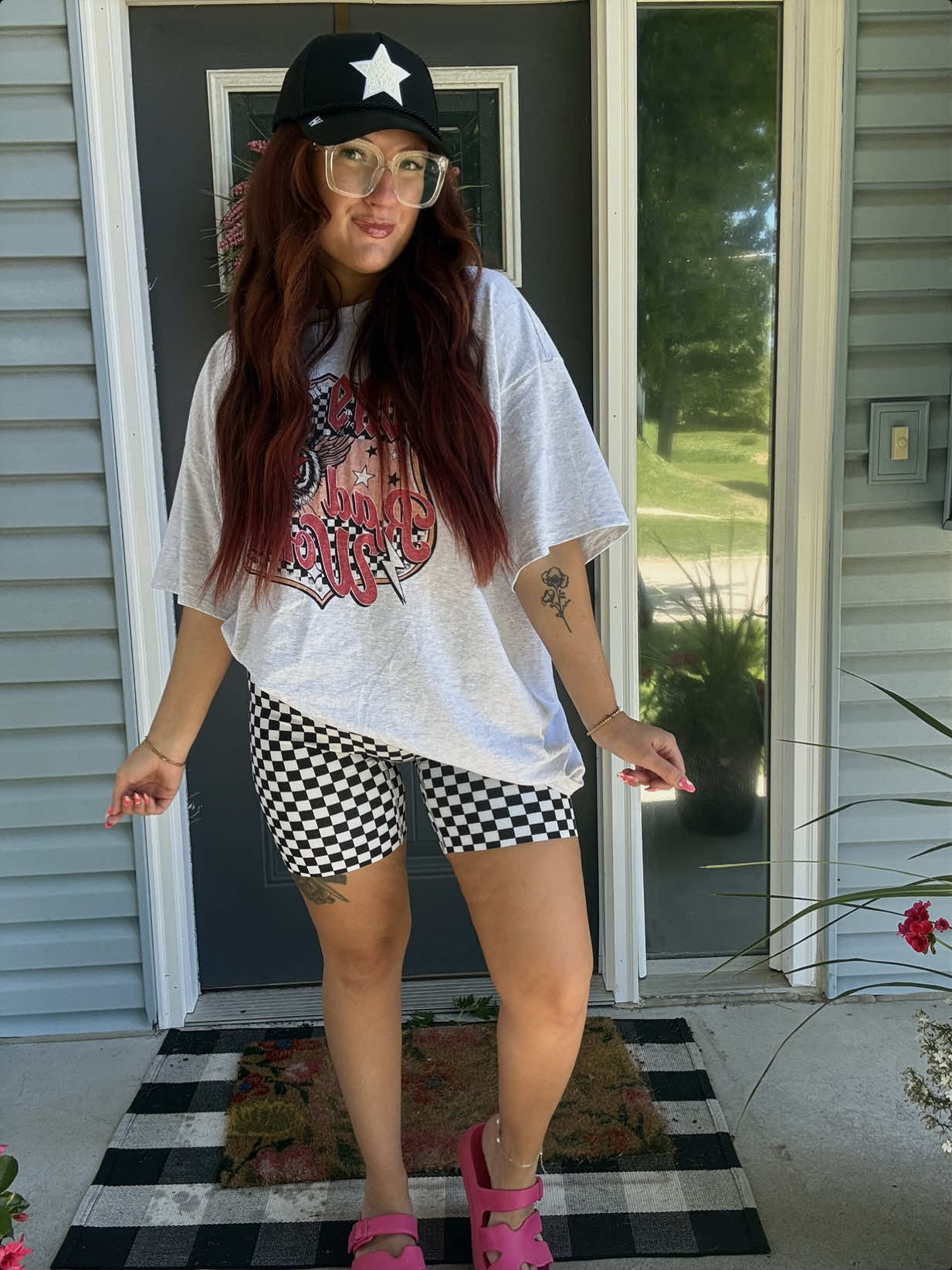 TikTok post by an influencer for Attached.. Caption reads: [...] in cute graphic tees 🖤 @Attached.....