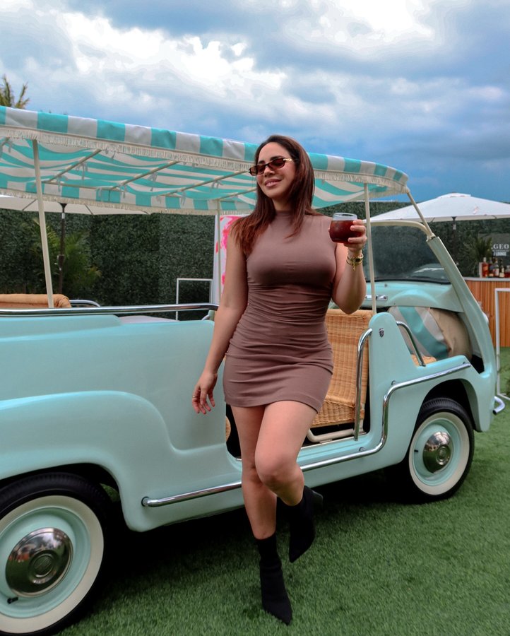 Instagram post by @whatthechic for Lavazza USA. Caption reads: F1 in the background, Lavazza in hand. This is a....