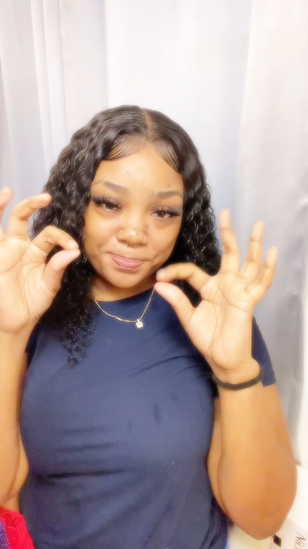 Instagram post by @itz.dannii_ for WestKissHair. Caption reads: Pretty curly wig, pretty girl😍😍
#westkiss....