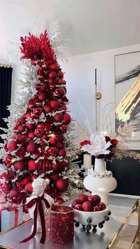 Instagram post by @wendywittwerdesign for Hobby Lobby. Caption reads: My 2025 Living Room Christmas Tree In Burgundy &....