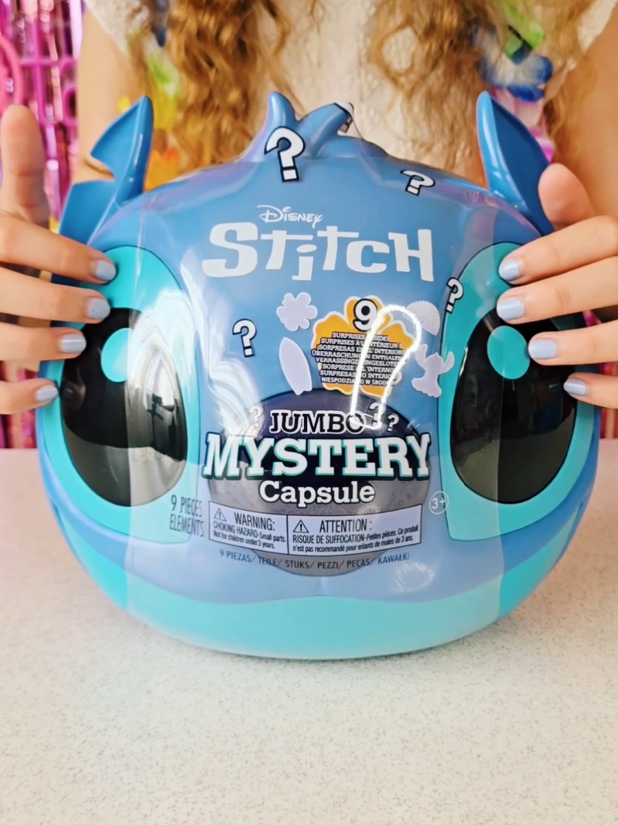 TikTok post by @tanjastoysreview for Smyths Toys Uk. Caption reads: [AD] 💙 #asmr Opening Disney Stitch Jumbo Mystery....