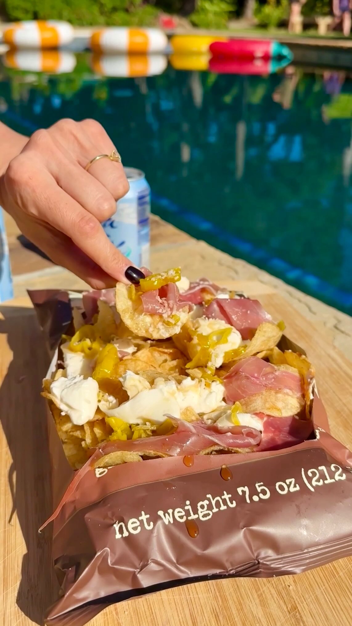 Instagram post by @ainttooproudtomeg for Mezzetta. Caption reads: Charcuterie Chips are my favorite viral recipe of....