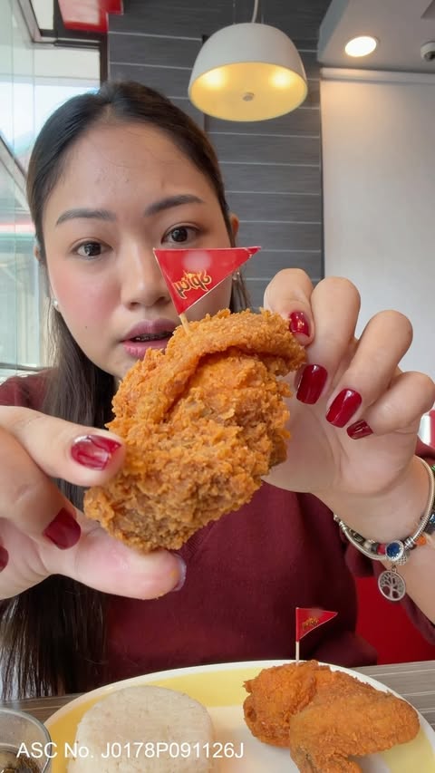 Instagram post by @danielebruceee for Jollibee. Caption reads: kain tayo jollibee spicy chickenjoy 🍗🌶️ ASC....
