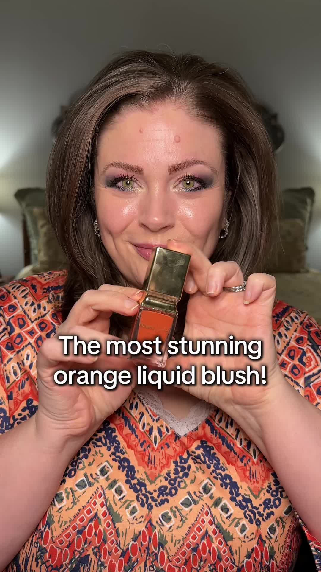 TikTok post by @melissa_beautyover40 for Adriana Nichole Cosmetics. Caption reads: [...] just call for an orange blush. @Adriana....