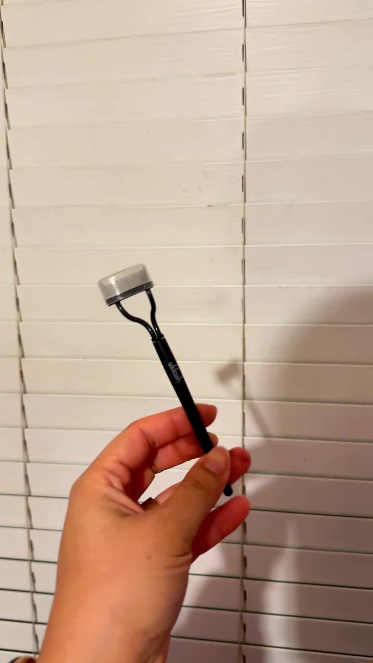 TikTok post by @janet.osayande for UKLASH. Caption reads: [...] with this lash separator 😉 @UKLASH  #uklash....