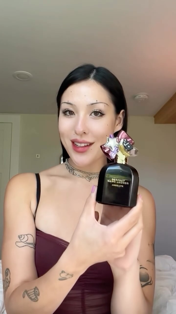 Instagram post by @cammyreviews for Marc Jacobs Fragrances. Caption reads: With ripe, caramelized fig, smooth jasmine, and a....