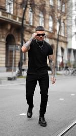 Instagram post by @arturkramer_ for Legend London. Caption reads: Ad* All Black #slim #streetstyle from....