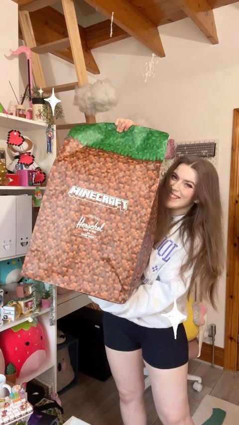 Instagram post by @celynhaf for Minecraft. Caption reads: I got the coolest MINECRAFT backpack! ✨🧡....