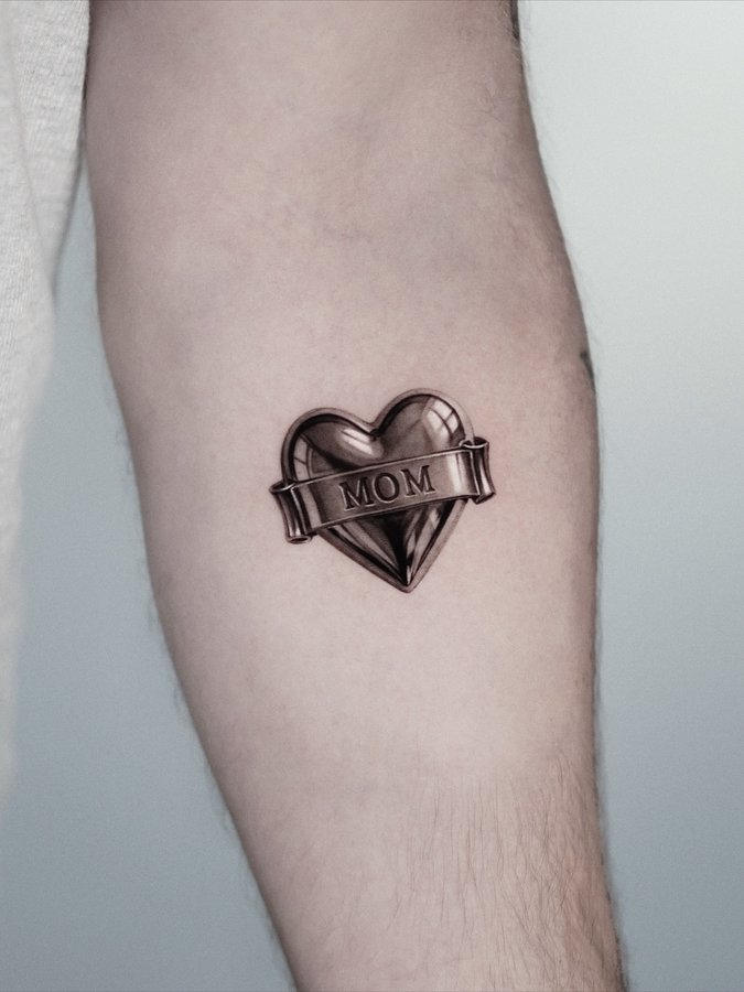 Instagram post by @4.4_tattoo for Dragonhawk Official. Caption reads: Chromed Heart 🖤
Done at @4.4_tattoo 
Sponsored by....