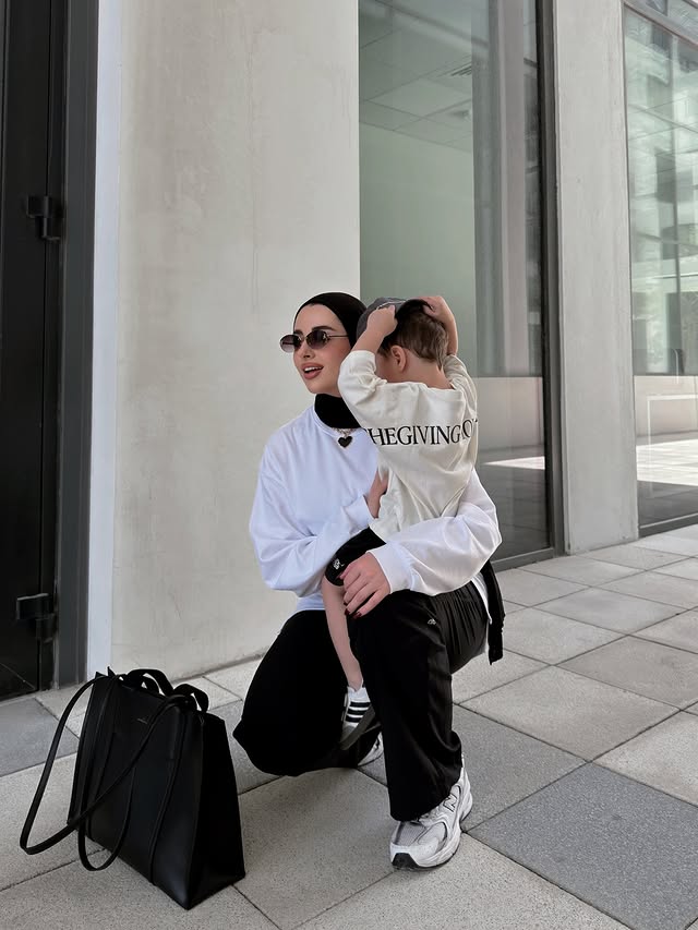Instagram post by @suzanaaljuneidi for The Giving Movement. Caption reads: Mom & Son love 🤍🫂 Matching @thegivingmovement....