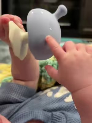 TikTok post by @trinity.expecting for mombella official. Caption reads: Nico’s been obsessed lately! 😂 #teething #teenmom....
