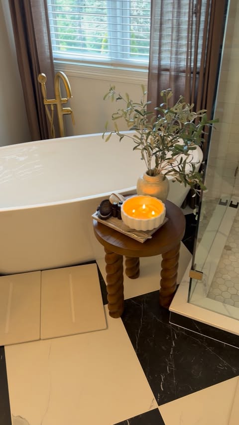 Instagram post by @homebyxi for Dorai Home. Caption reads: I already had one next to the tub… but watching....