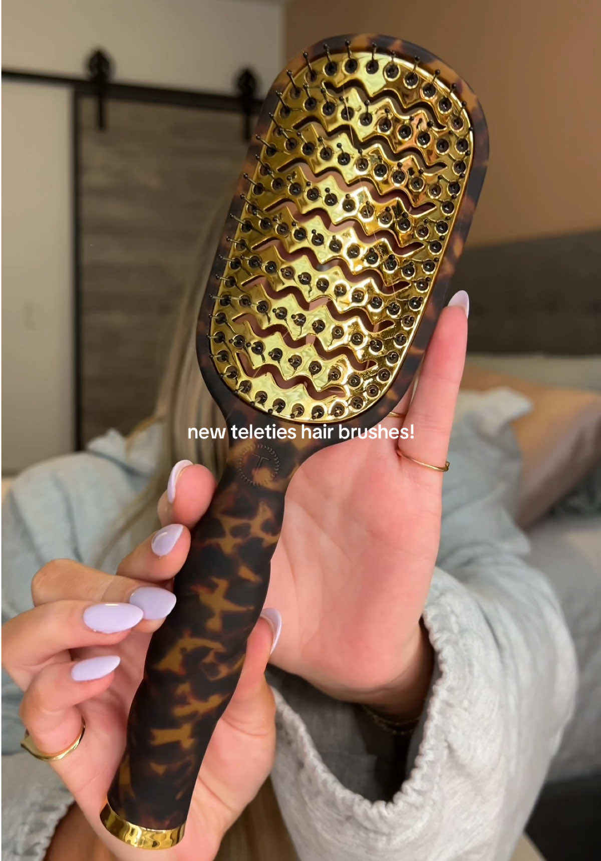 TikTok post by @emilyirlbeck for TELETIES. Caption reads: cutest hairbrush ever @TELETIES .