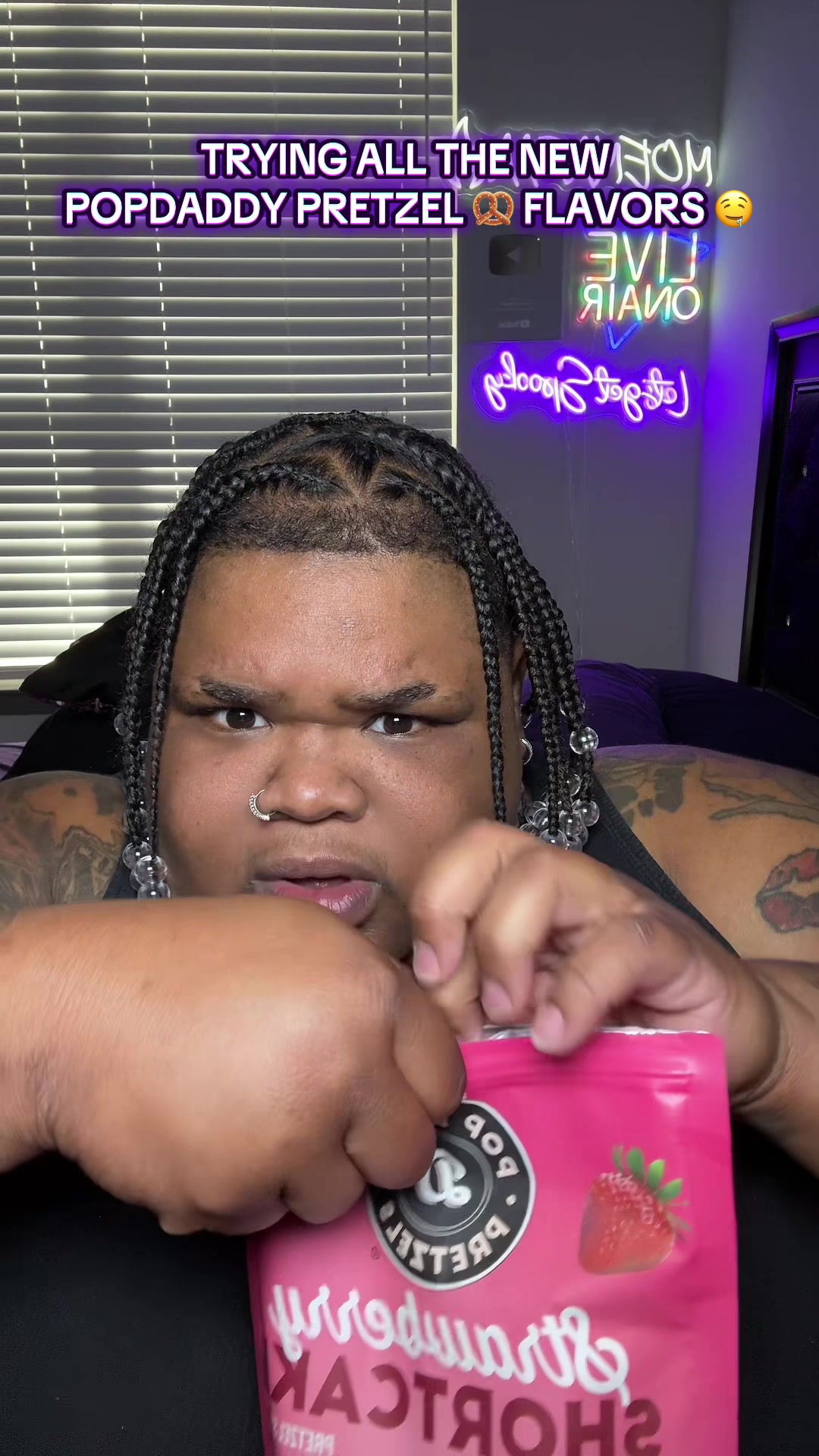 TikTok post by @tha_dripp_phamily for Popdaddy Snacks. Caption reads: TRYING POPDADDY NEW PRETZEL 🥨 🤤FLAVORS!!....
