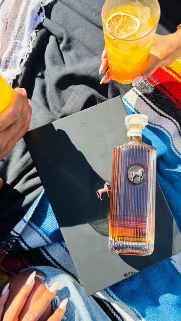 Instagram post by @justaddhotsauce for Belvedere Vodka. Caption reads: this summer is all about being outside with your....