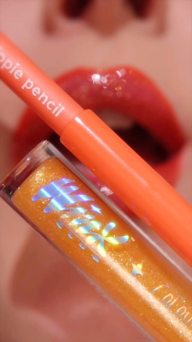 Instagram post by @eveemax for Winx Club. Caption reads: [...] better 😃💋🧡 . @colourpopcosmetics x....