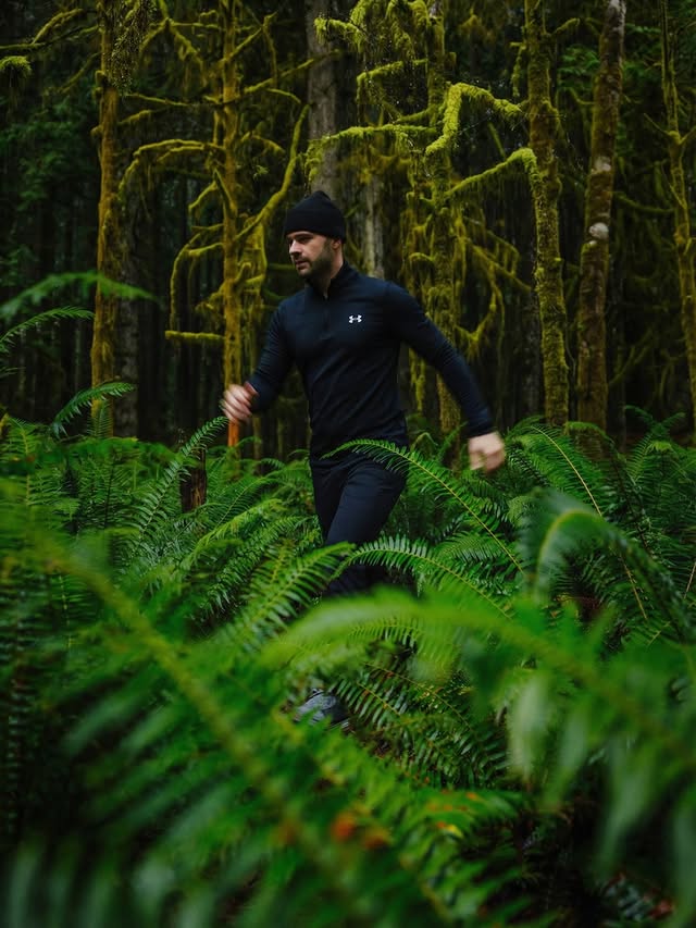 Instagram post by @calsnape for Under Armour. Caption reads: Winter hiking through the rainforest 🌿 This....