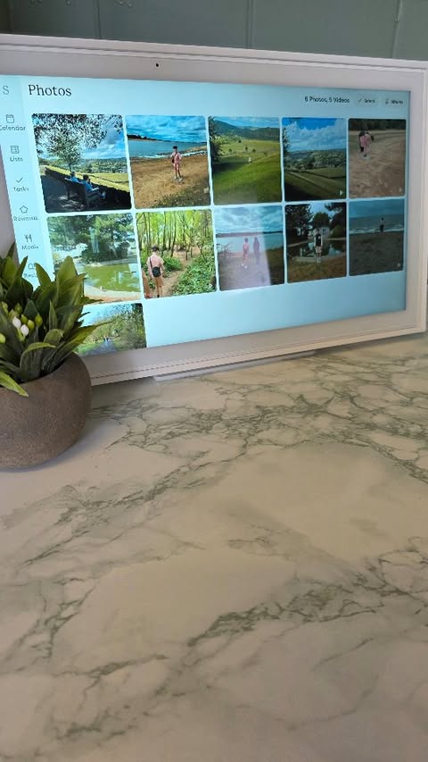 Instagram post by @rebeccaedwardsxx for Skylight Frame. Caption reads: Ad Goodbye, paper clutter. Hello, sanity. 🗓️✨ Our....