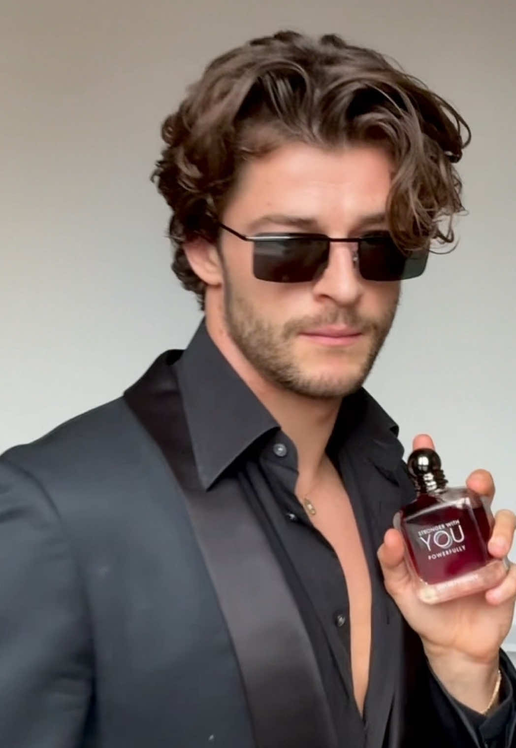 TikTok post by @itssamsalter for Armani beauty. Caption reads: AD For your most seductive side… new @Armani....