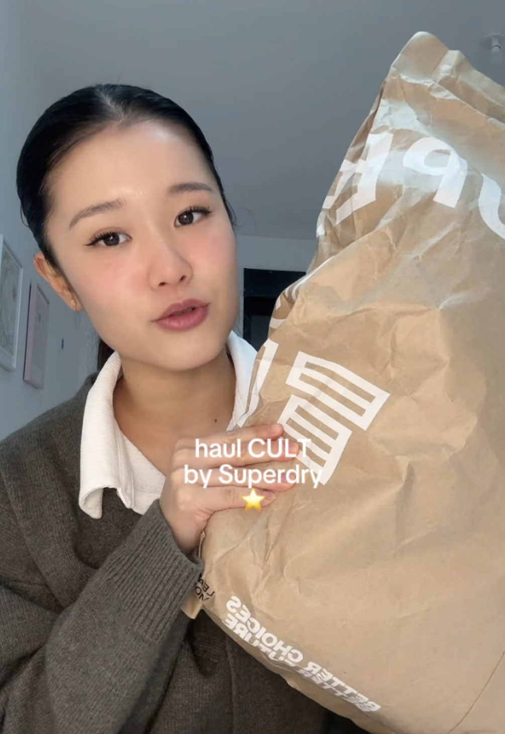 TikTok post by @sophiiezhou for Superdry. Caption reads: [...] pour mon échange en Chine 🫶🏻 @CULT by....