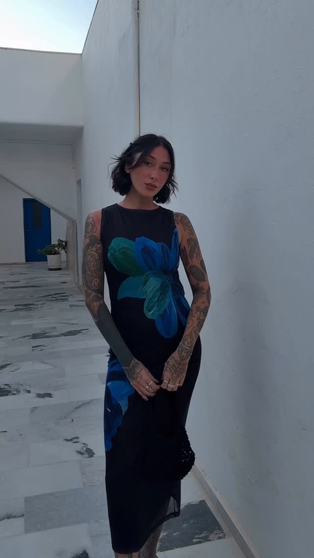 Instagram post by @stephowens_tattoo for Motel Rocks. Caption reads: The perfect dress to wear in Greece ! 💙 🩵....