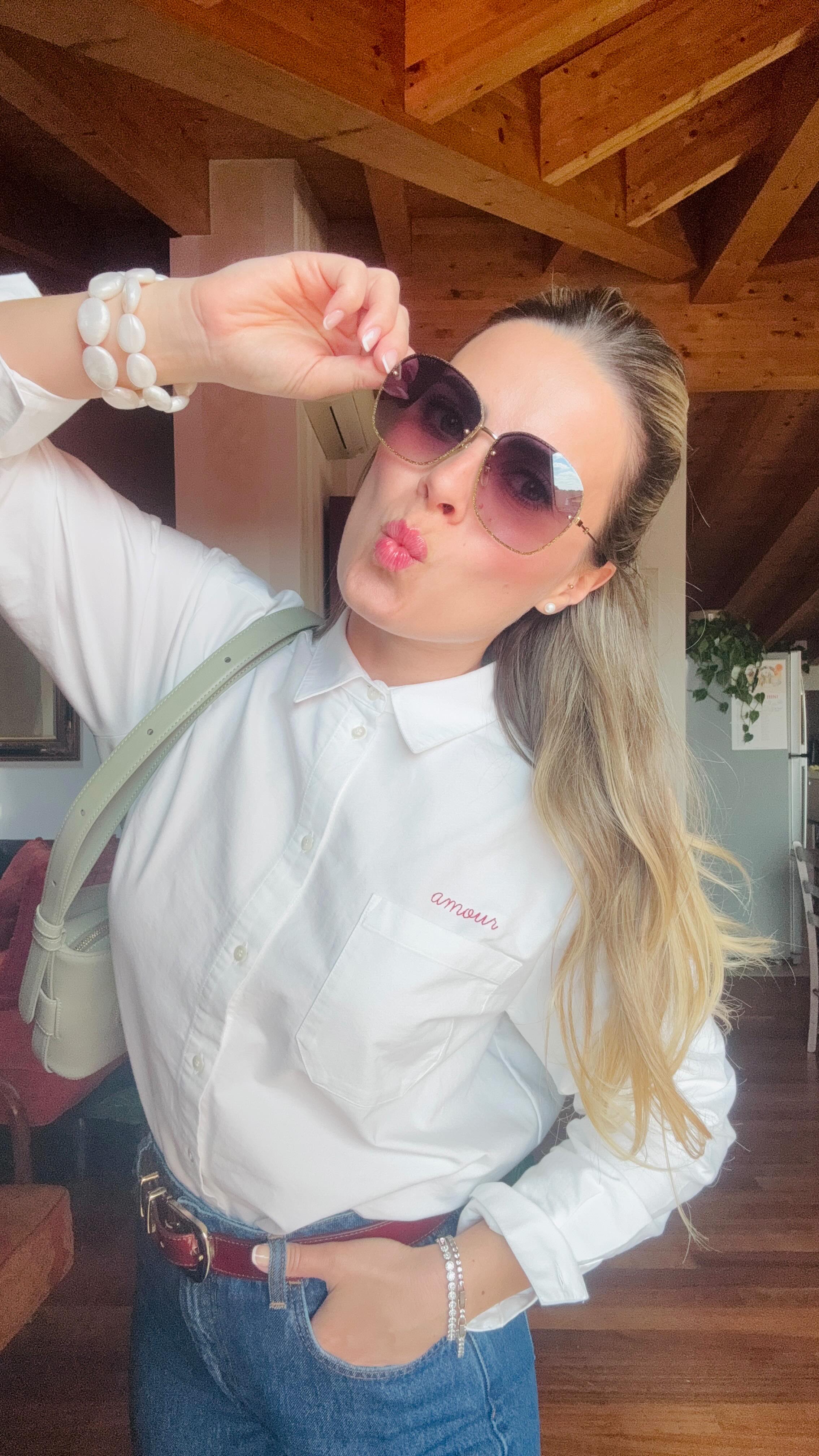Instagram post by @ilaria_rodella for Poleneparis. Caption reads: Basta una camicia bianca con la scritta AMOUR e la....
