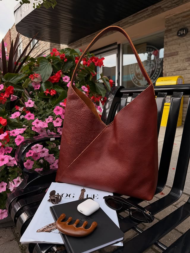 Instagram post by @dear.septemberrr for Portland Leather Goods. Caption reads: okayyy this bag 🤎🍂 @portlandleather Genuine....