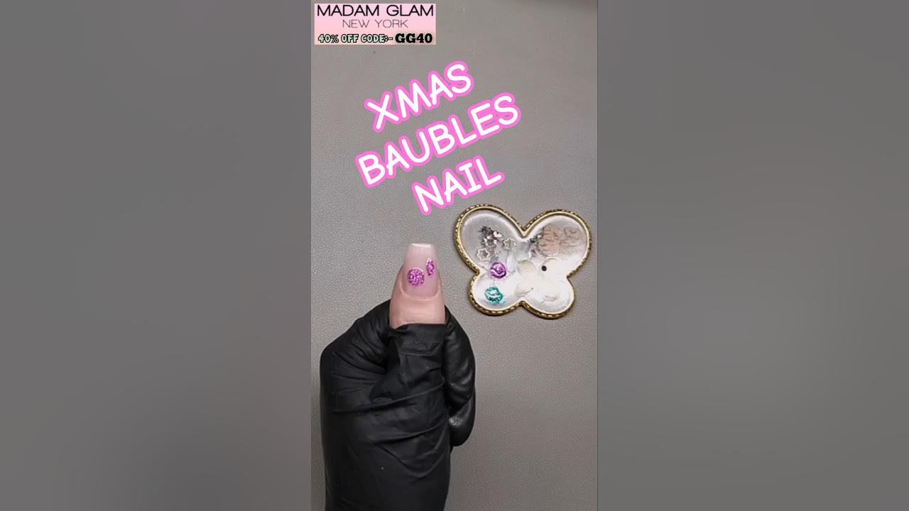 YouTube post by @NAILSWITHGG for Madam Glam. Caption reads: [...] bauble nail art design, Ft.....
