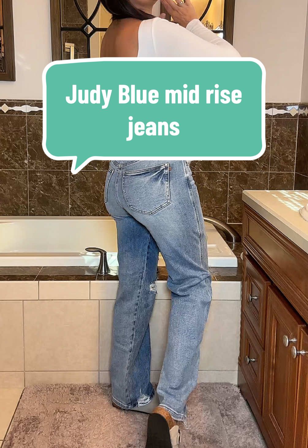 TikTok post by @dana_ann2 for Emma Lous Boutique. Caption reads: Judy Blue just came out with a midrise 90’s style....