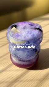 Instagram post by @yourcoffeedude for The Isopure Company. Caption reads: Tropical Berry Glitter-ade ✨🧊....