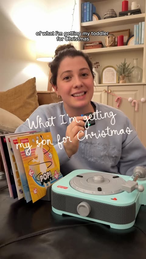 Instagram post by @otmarissa for Fisher-Price. Caption reads: The perfect gift for the music-loving toddler in....