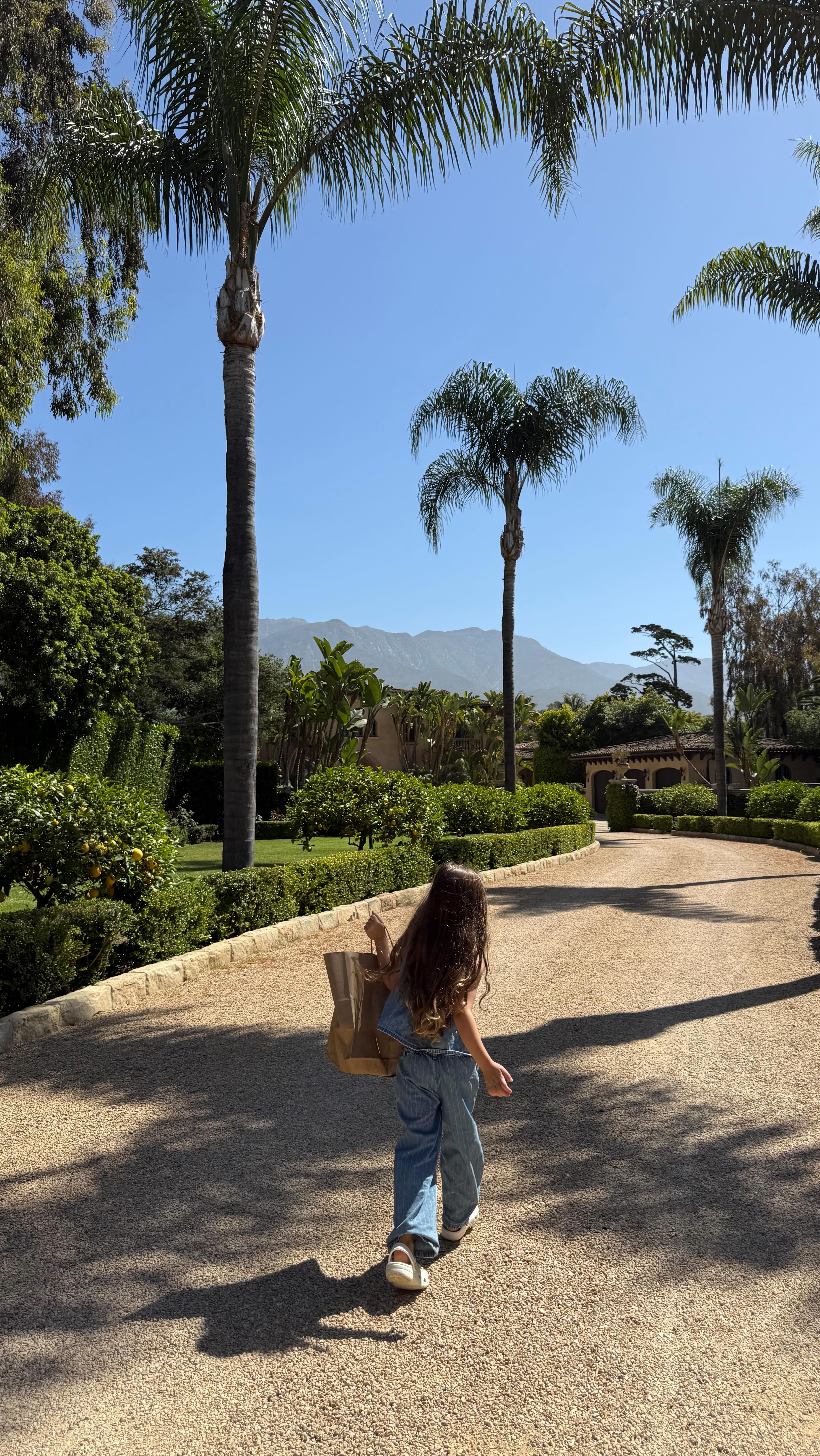 Instagram post by @stephweizman for Dagne Dover. Caption reads: Making sure her backpack passes the fashion test....