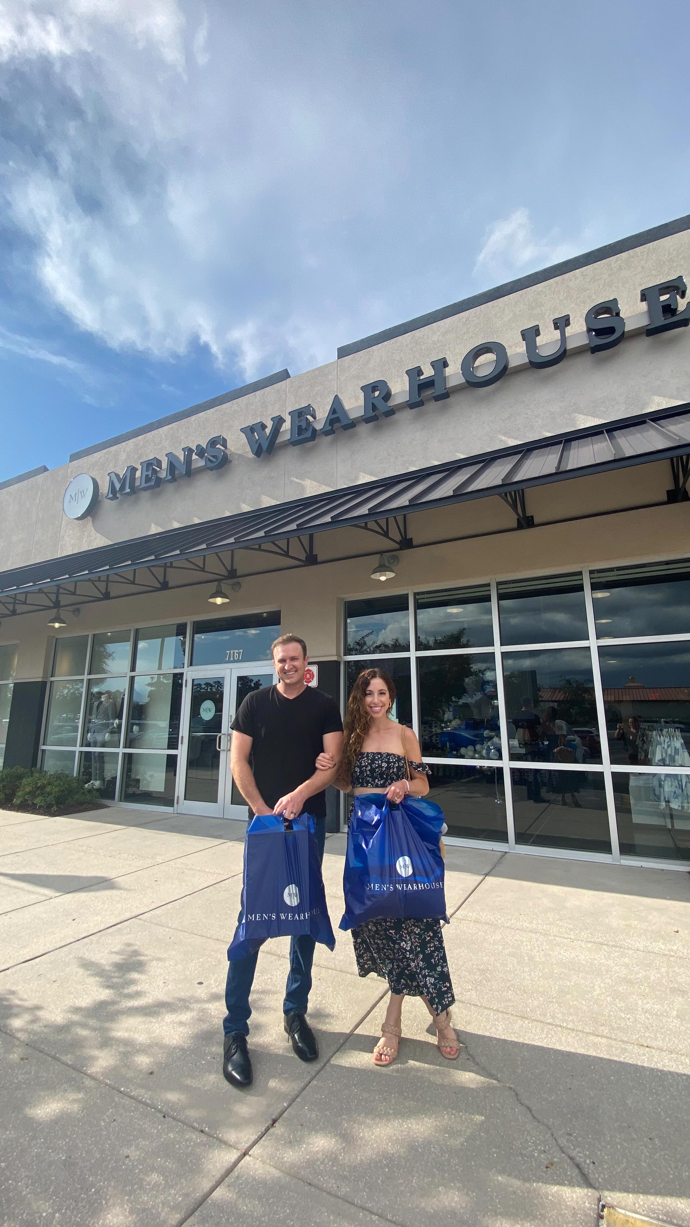 Instagram post by @cherhubsher for Men’s Wearhouse. Caption reads: 🚨 New @menswearhouse location alert (7167 Coastal....