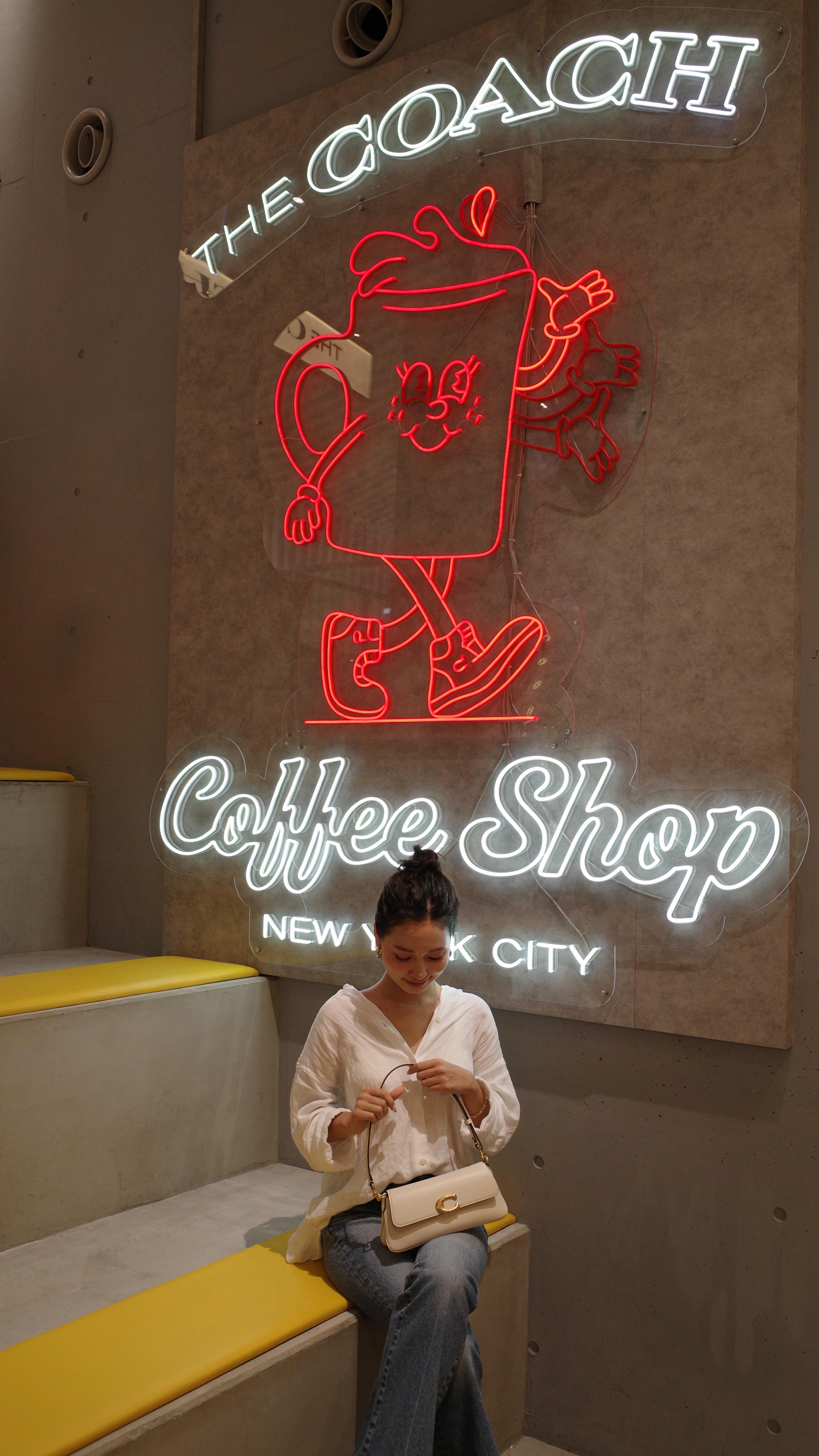 Instagram post by @33___chan for Coach. Caption reads: the coach coffee shop club ☕️🍪💛
📍coach play @....