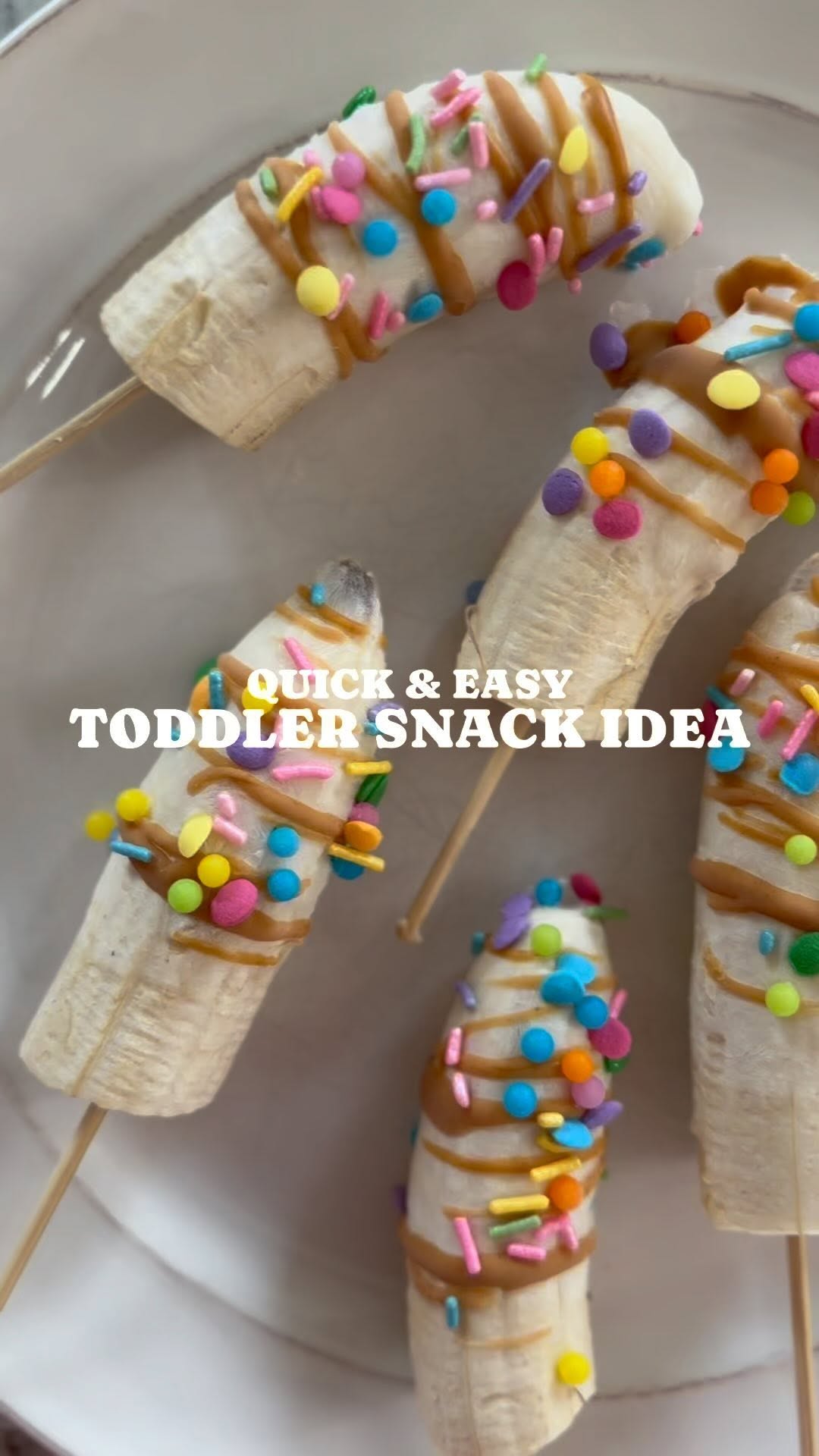 Instagram post by @katieannemach for Hy-Vee. Caption reads: EASY TODDLER SNACK IDEA: FROZEN BANANA YOGURT POPS....