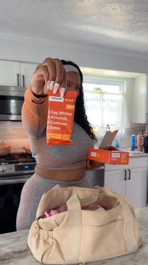 Instagram post by @qiqi for RXBAR. Caption reads: #ad GRWM for the gym, but this time with a little....