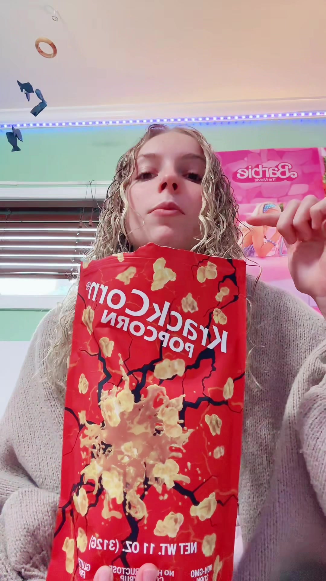 TikTok post by @reina_unger for KrackCorn Popcorn. Caption reads: It’s just so good #fyp #foryoupage @KrackCorn....