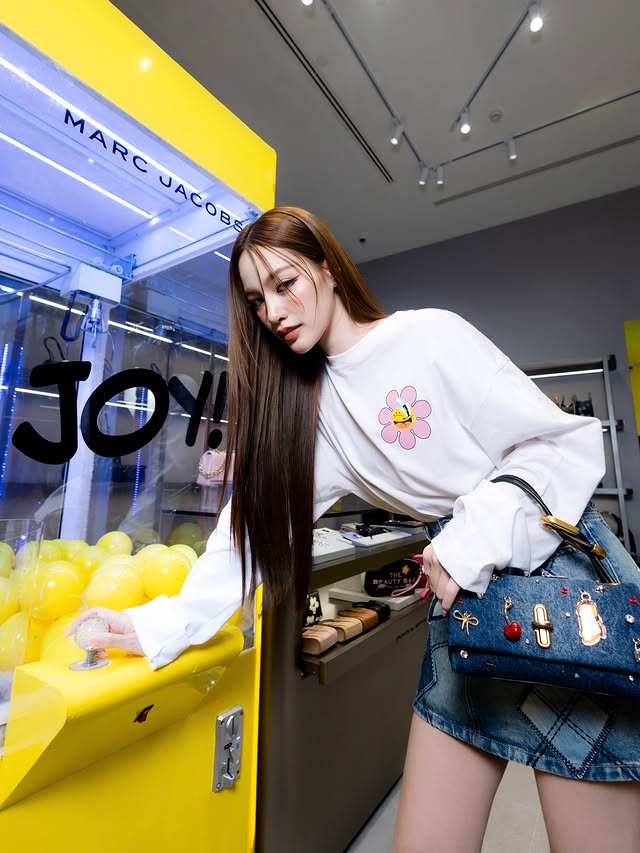 Instagram post by @phinyanech.h for Marc Jacobs. Caption reads: Joy in the little moments. ✨ 
🤍 Marc Jacobs....