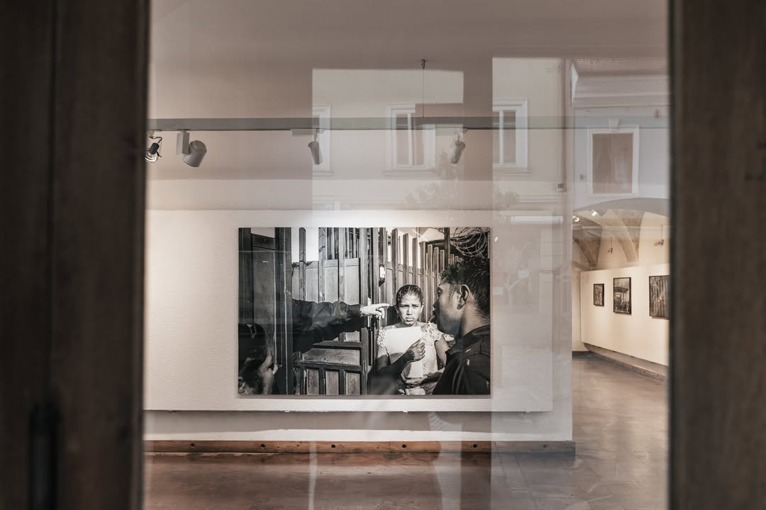Instagram post by @alecegarra for Leica Camera. Caption reads: The exhibition 𝘛𝘩𝘦 𝘛𝘸𝘰 𝘞𝘢𝘭𝘭𝘴 by ​Kranj....