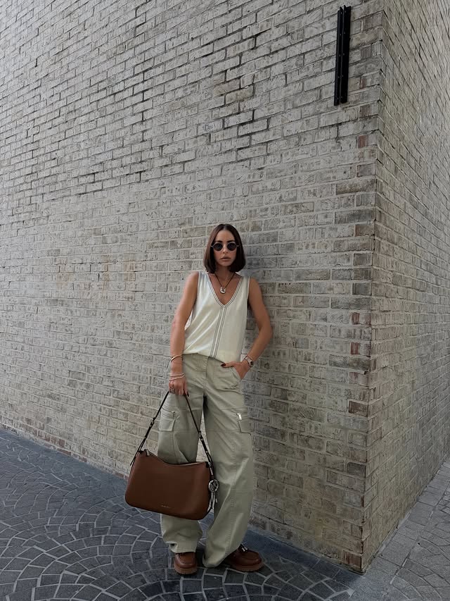 Instagram post by an influencer for Michael Kors. Caption reads: resort ease, city attitude. @michaelkors....